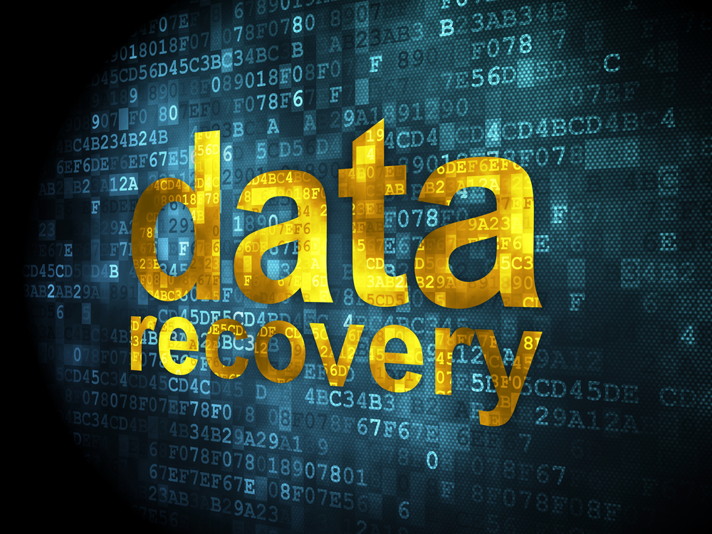 Information concept: data recovery on digital background Data recovery text over a digital code background representing backup and file restoration.