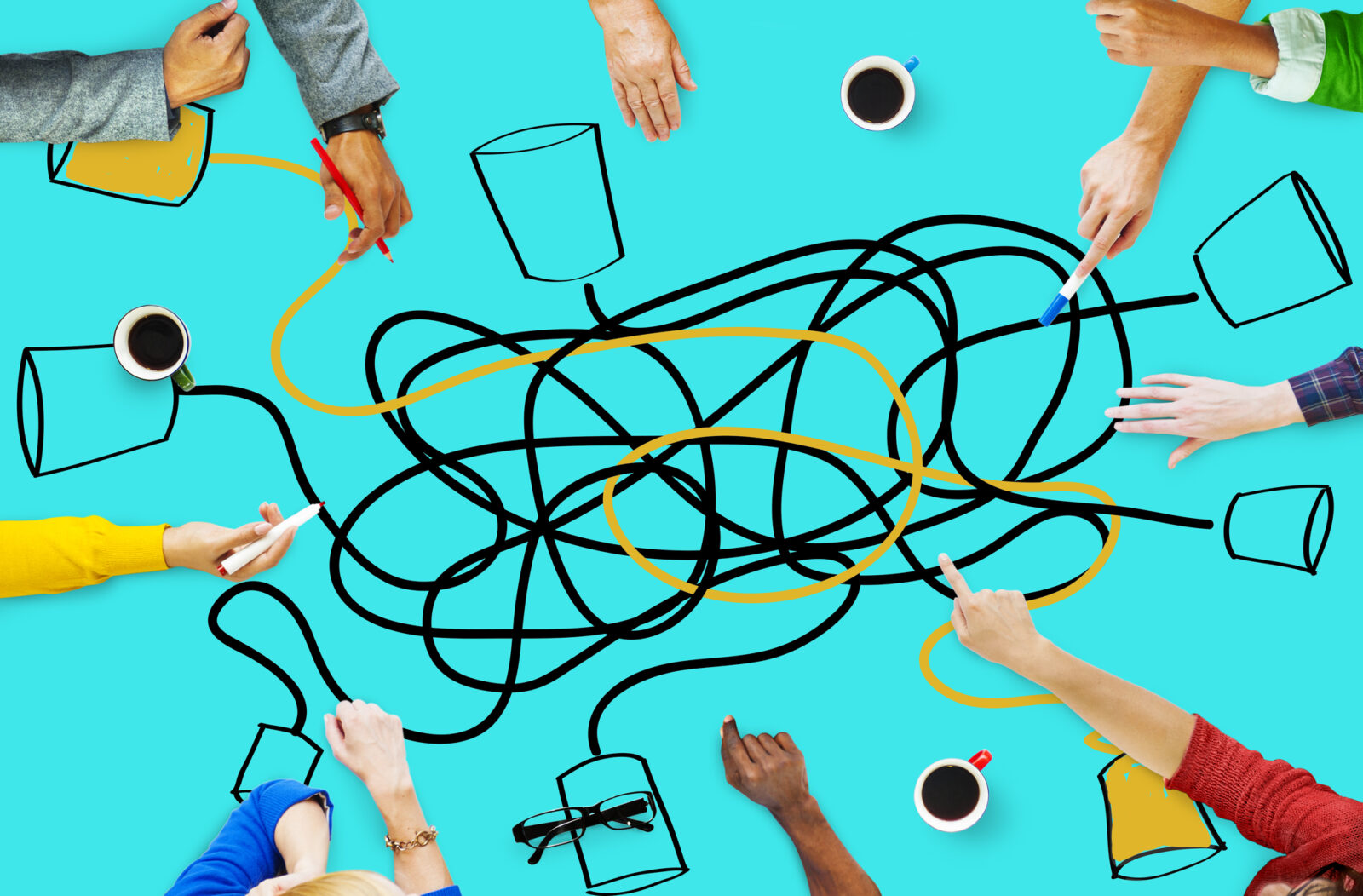 Hands drawing connected lines on a turquoise table, representing Microsoft Teams communication and collaboration.