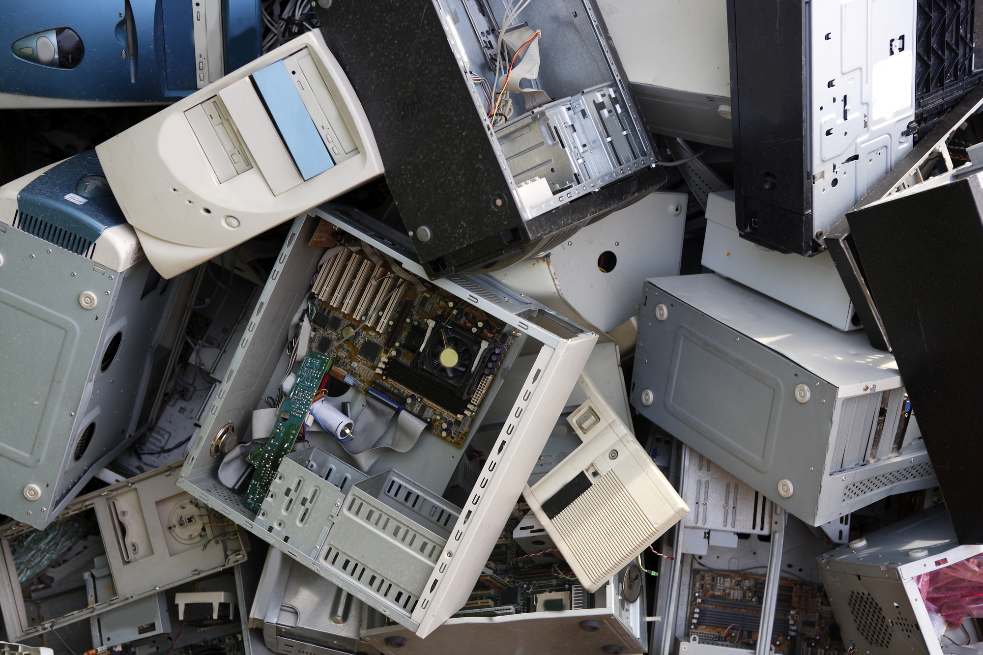 hardware computer desktop recycle industry Pile of old computer parts and cases representing e-recycling and technology disposal.
