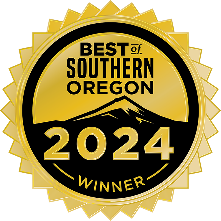 Gold and black circular badge with a mountain graphic and text that reads “Best of Southern Oregon 2024 Winner.”